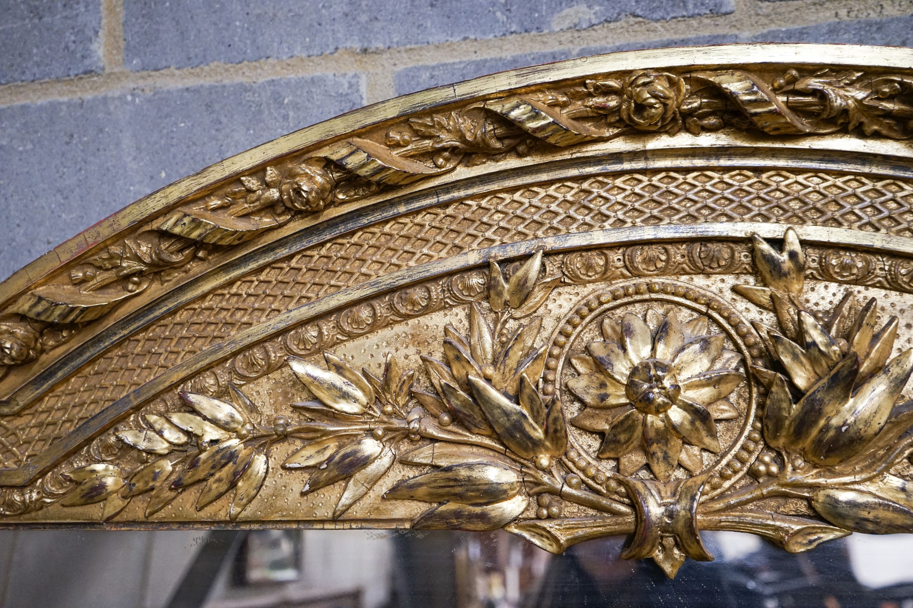 A Victorian carved giltwood and gesso overmantel mirror, the plate flanked by fluted columns, width 155cm, height 178cm